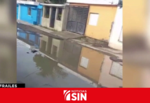 Residentes denuncian calles llenas de hoyos y aguas residuales en Santo Domingo Este